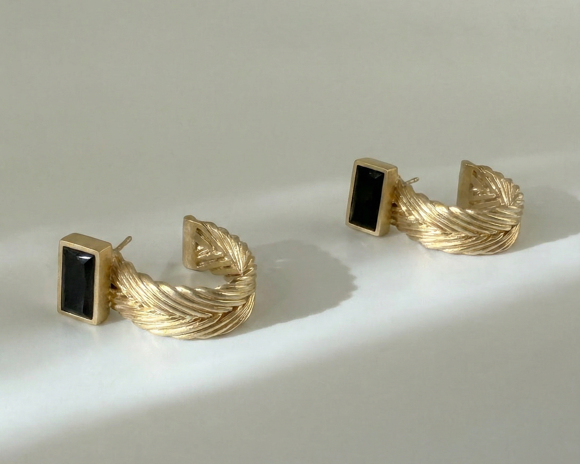 Close-up of Bobbie Jacket handwoven earrings showing dimensional woven texture and Kefi signature finish in gold vermeil