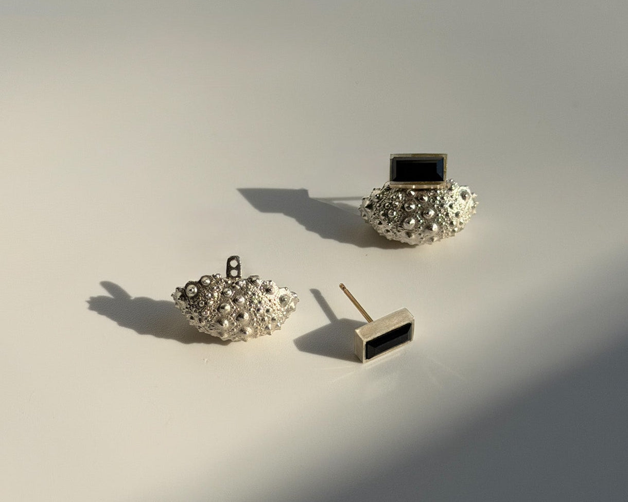 View of Ceto urchin ear jacket in sterling silver showing post hole compatibility