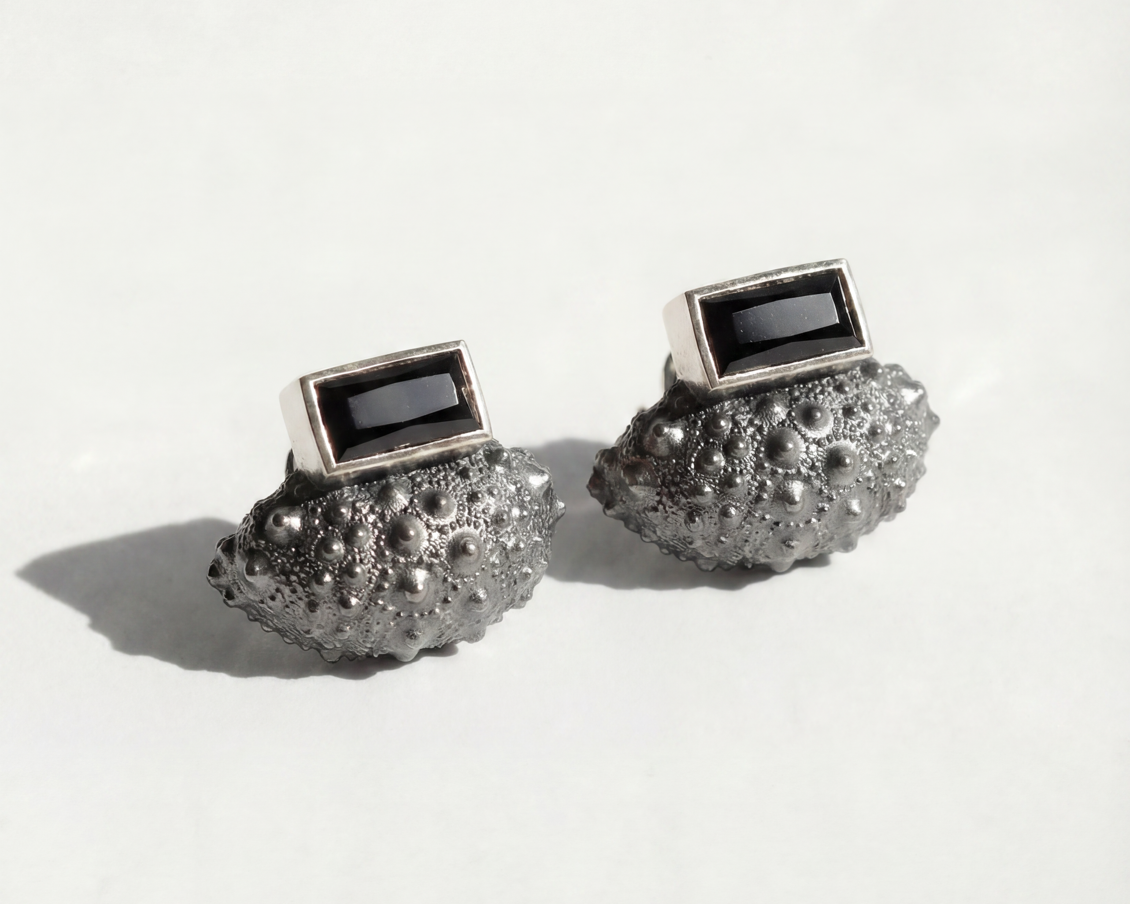 Ceto sea urchin ear jacket set with black spinel post in oxidized sterling silver and polished sterling silver, handmade by Kefi jewelry