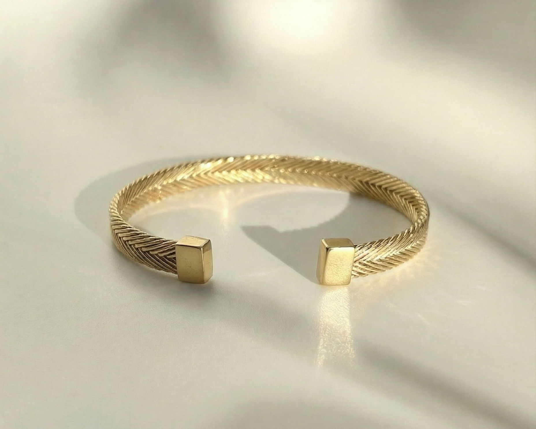 Persephone Woven Cuff in gold vermeil with handwoven textured band and sculptural form by Kefi