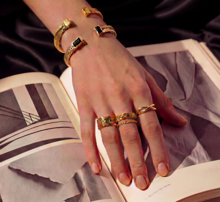 Model wearing Persephone Woven Cuff in gold vermeil, showcasing sculptural woven texture and statement presence