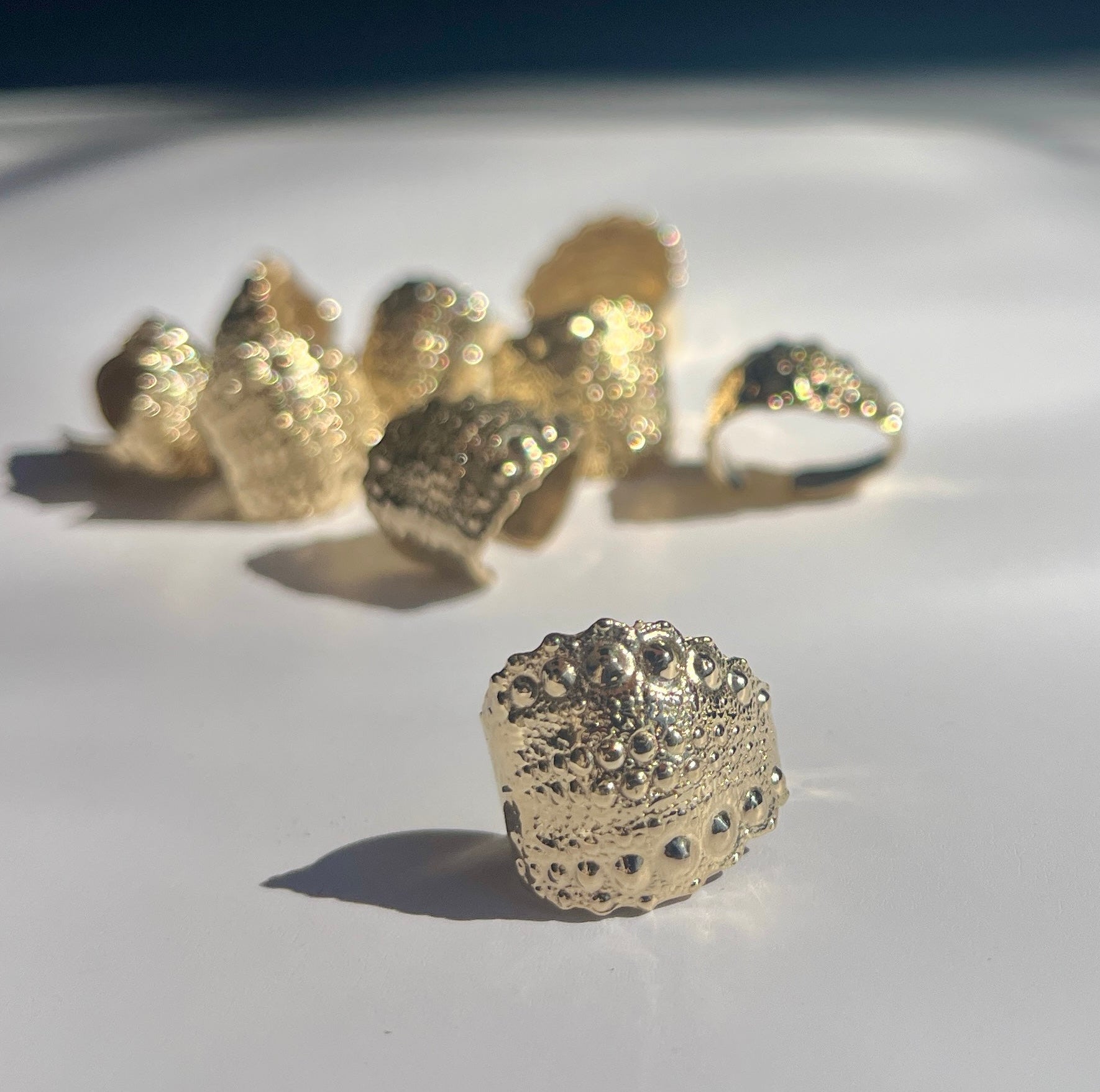 Urchin Cuff in gold vermeil with preserved sea urchin shell texture and sculptural cuff silhouette by Kefi