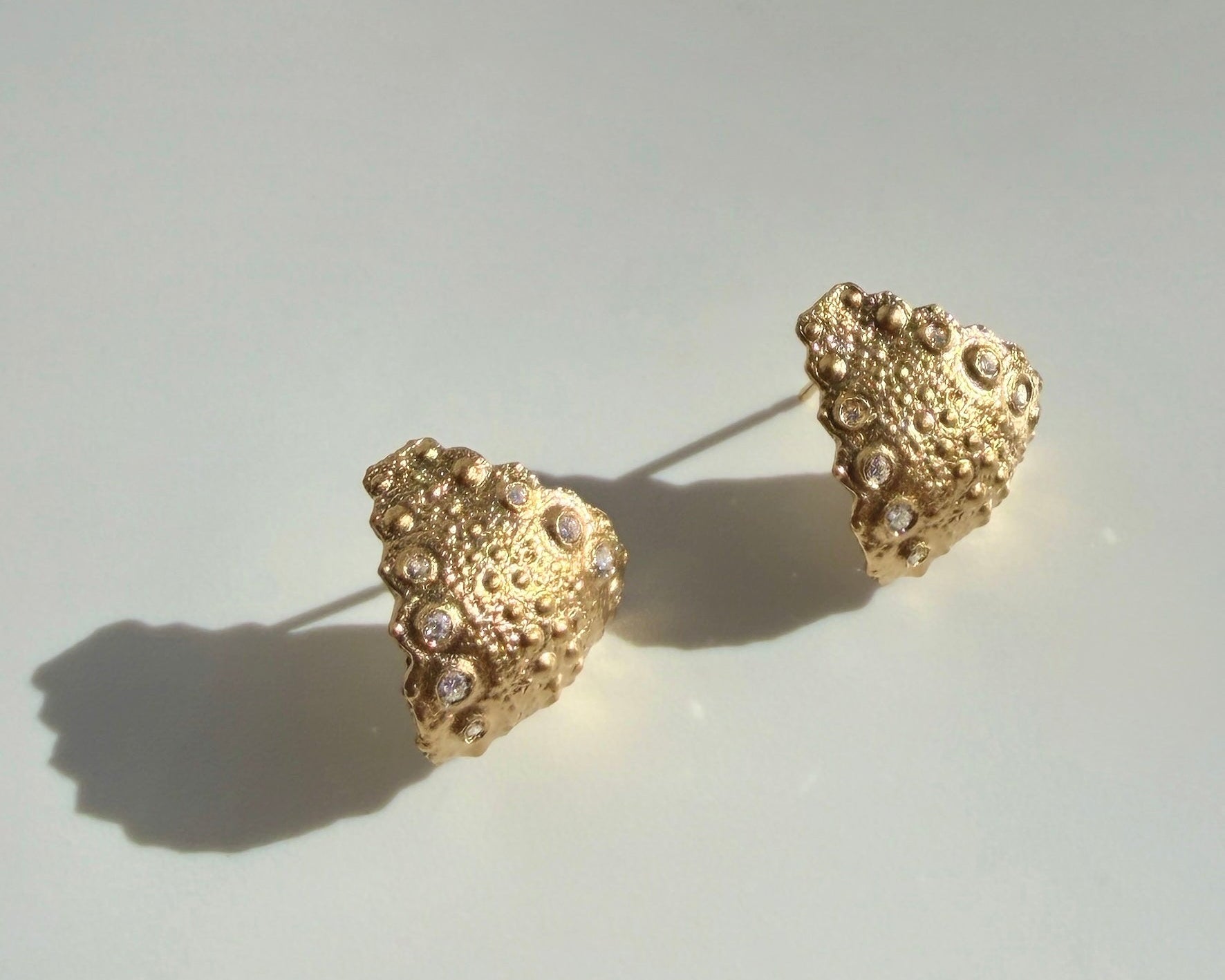 Urchin Hug Earrings in gold vermeil with preserved sea urchin shell texture and sculptural hoop design by Kefi